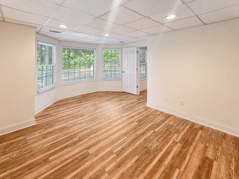 Bay-window bedroom in the walkout basement at 1030 Billy Mantle Lane