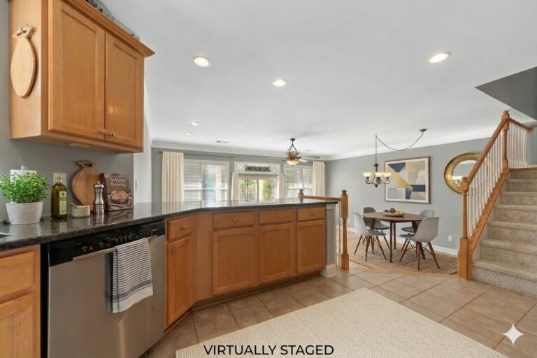 Virtually staged breakfast bar and dining area in an Eatonton townhome on Lake Oconee