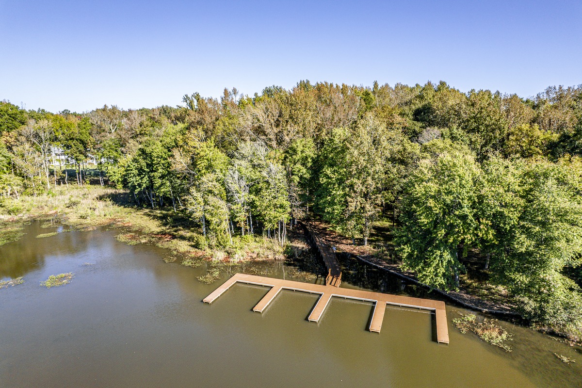 Community docks reaching into a quiet cove of Lake Oconee at Carriage Cove