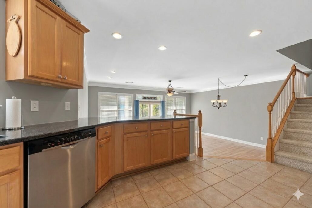 Granite breakfast bar open to the living area and stairs at 181-A Farriers Lane, a townhome on Lake Oconee