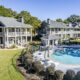 Back of 181-A Farriers Lane at Carriage Cove on Lake Oconee, with the community pool and pool house behind the building
