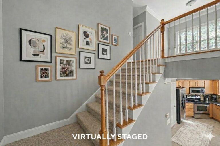 Virtually staged stairwell with a gallery wall in an Eatonton condo on Lake Oconee