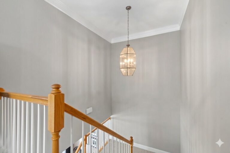 Upstairs landing with a lantern pendant light at 181-A Farriers Lane, a Lake Oconee townhome for sale