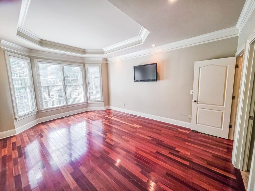 Primary bedroom bay windows and tray ceiling at 2750 Club Drive in Harbor Club
