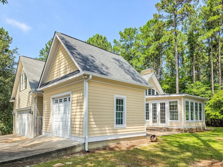 Side elevation of 2750 Club Drive showing the garages and the sunroom addition