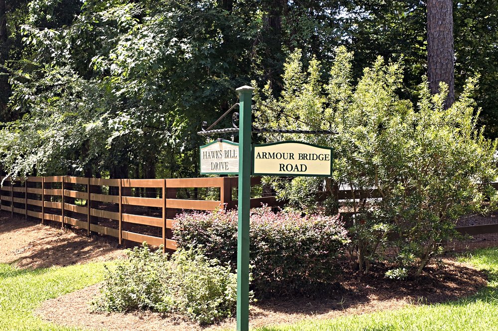 Hawks Bill Drive and Armour Bridge Road street signs in the Beaverdam and West Place community at Lake Oconee