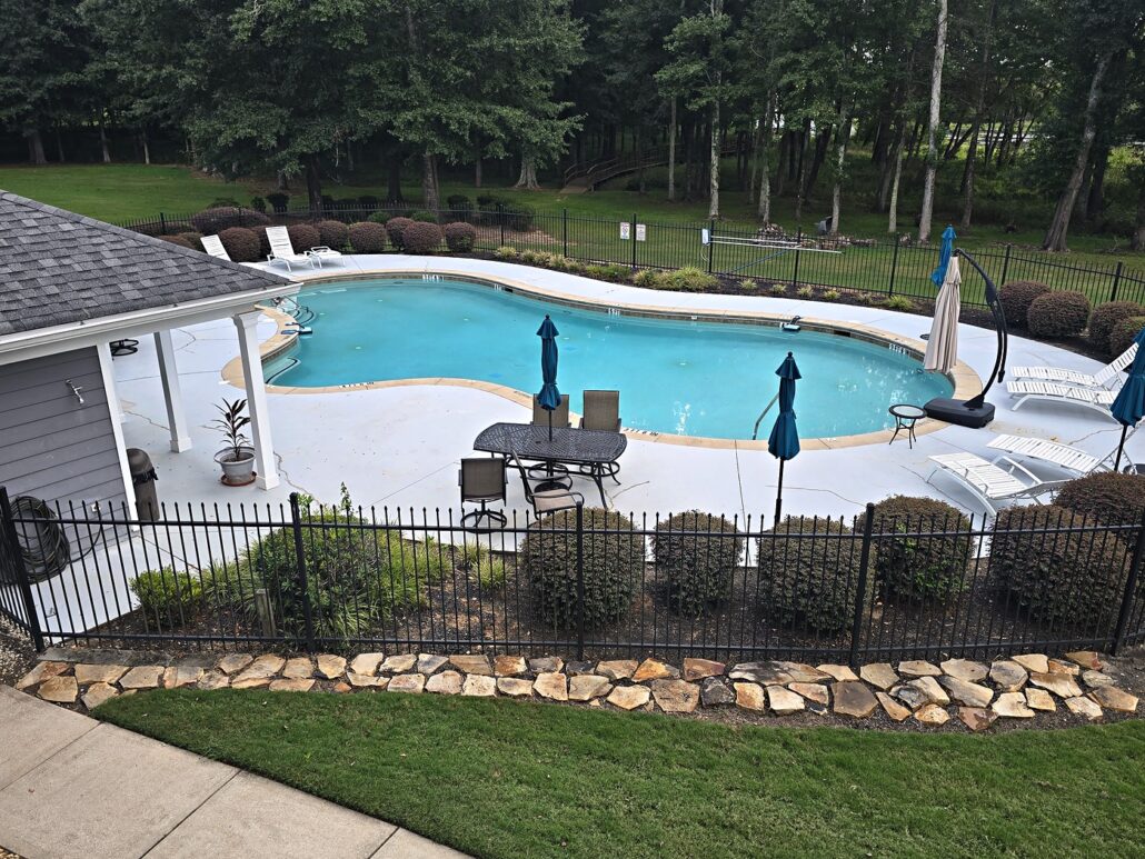 Fenced community pool and pool house at Carriage Cove, a Lake Oconee townhome community in Eatonton