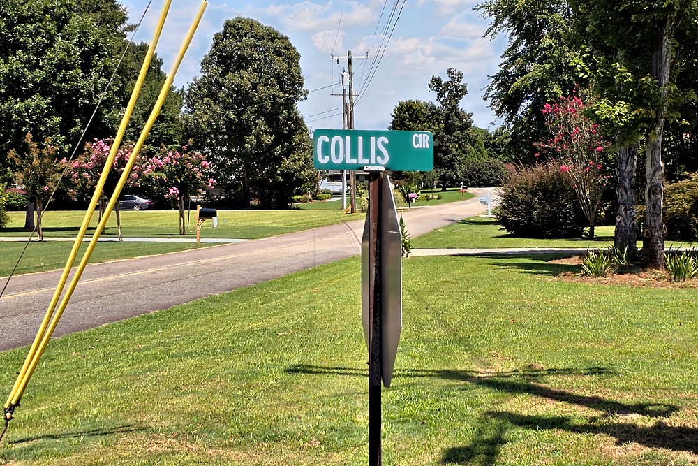 Collis Circle street sign in Water Oaks on Lake Oconee, showing the subdivision’s flat terrain