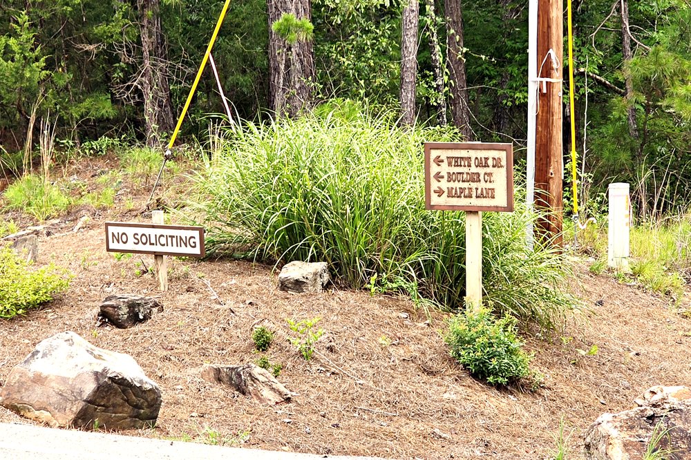 White Oak Drive, Boulder Court, and Maple Lane street signs in Double Branches at Lake Oconee