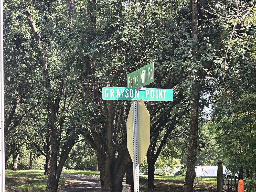 Street sign reading Grayson Point at the Parks Mill Road junction at Lake Oconee in Morgan County, Georgia