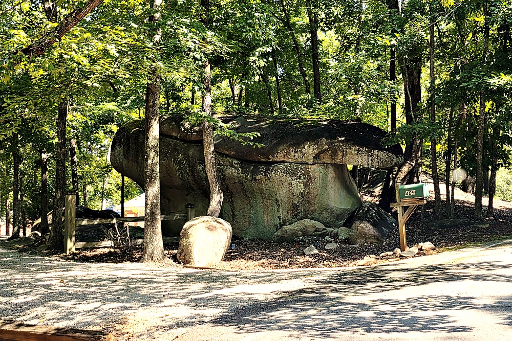 Large granite boulder outcrop along the road in Long Shoals Crossing on Lake Oconee