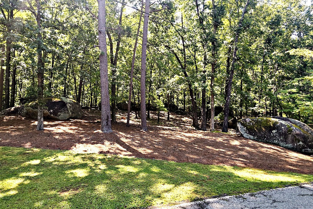 Granite boulders scattered through the wooded terrain of Long Shoals Crossing on Lake Oconee