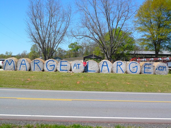 Marge at Large spray painted on hay bales along Lake Oconee Parkway in 2011