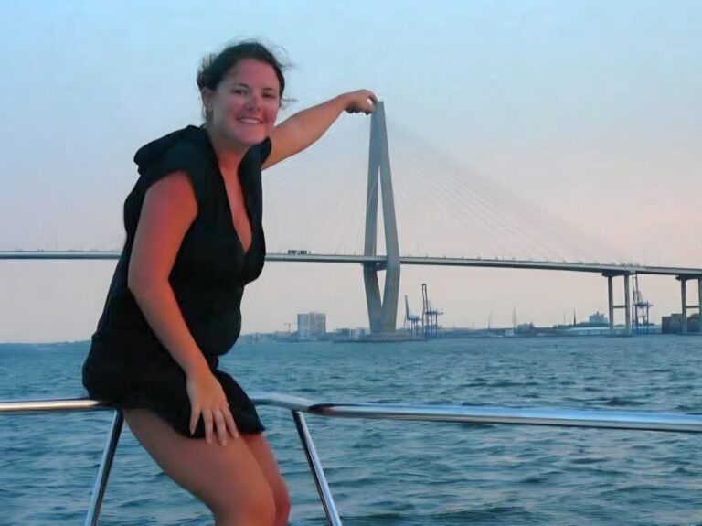 Margie Sorrell on the water in Charleston, South Carolina, with the Ravenel Bridge behind her