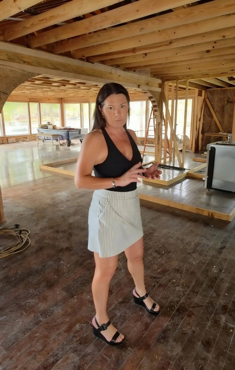 Margie Sorrell filming a video for social media inside a Lake Oconee house under renovation in 2026