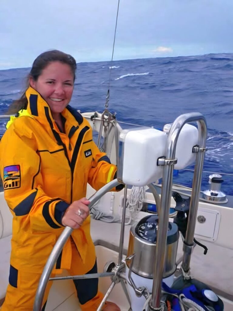 Margie Sorrell at the helm of her sailboat on the South Pacific