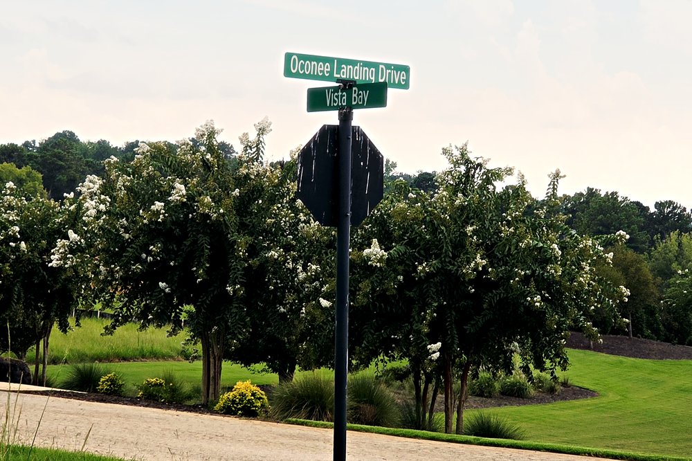 Oconee Landing Drive and Vista Bay street signs inside Oconee Landing at Lake Oconee