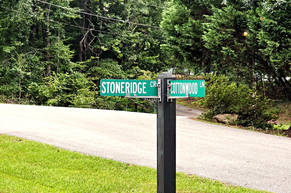Stoneridge Circle and Cottonwood Lane street signs inside the Indian Hills, Pioneer Woods and Stoneridge community at Lake Oconee