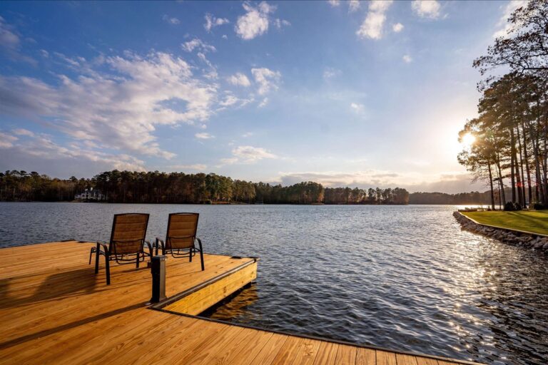 Dock with two chairs looking out over Lake Oconee, Georgia at sunset
