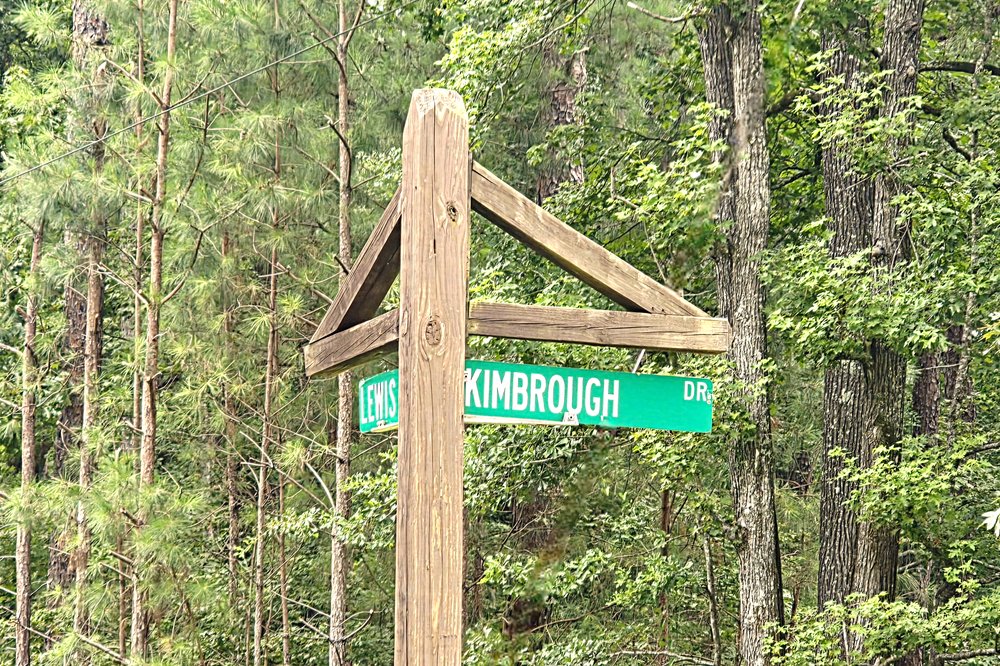 Kimbrough Drive and Tal Lewis Road street signs in Whispering Pines and Rocky Creek at Lake Oconee