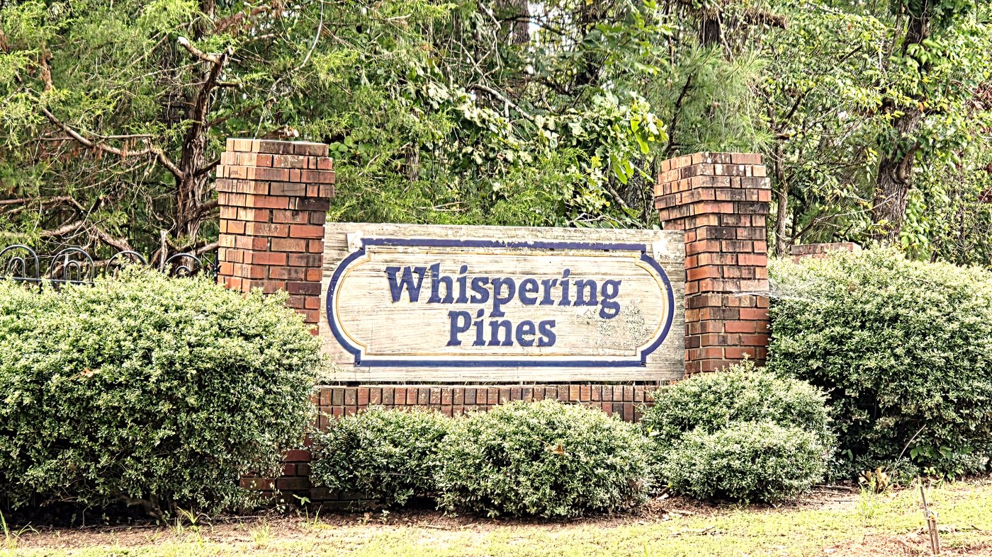 Whispering Pines neighborhood entrance sign off Kimbrough Drive on the White Plains side of Lake Oconee in Greene County, Georgia